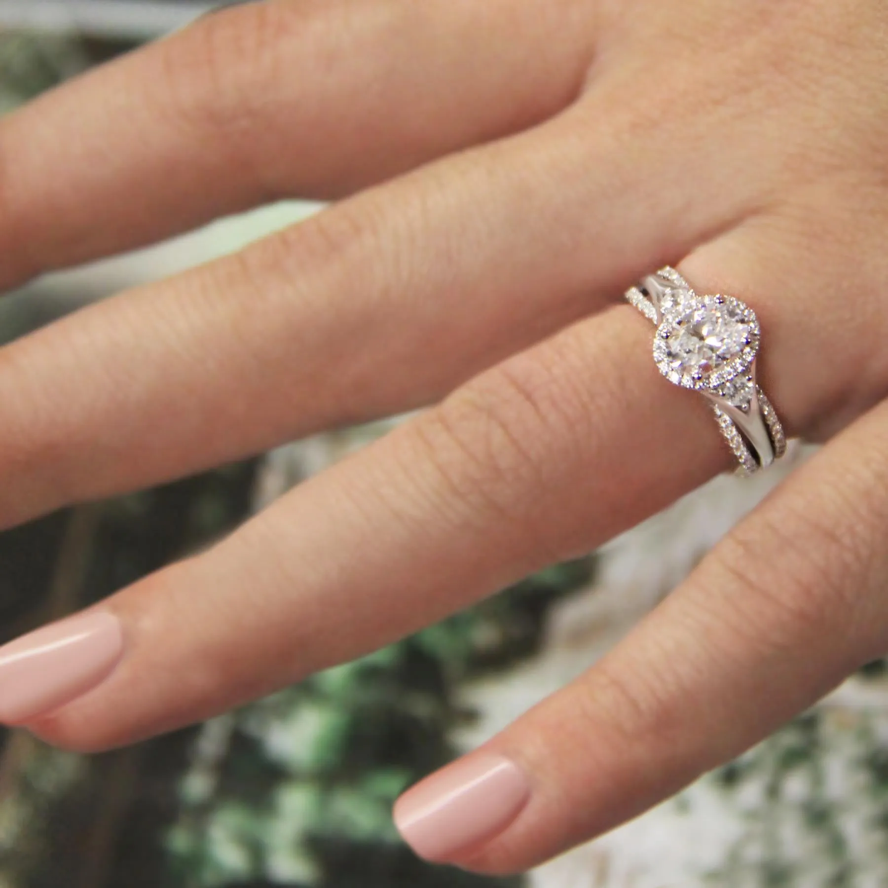 14KT Gold 1 1/2 CTW Oval Diamond Intertwined 3 Stone Halo Ring